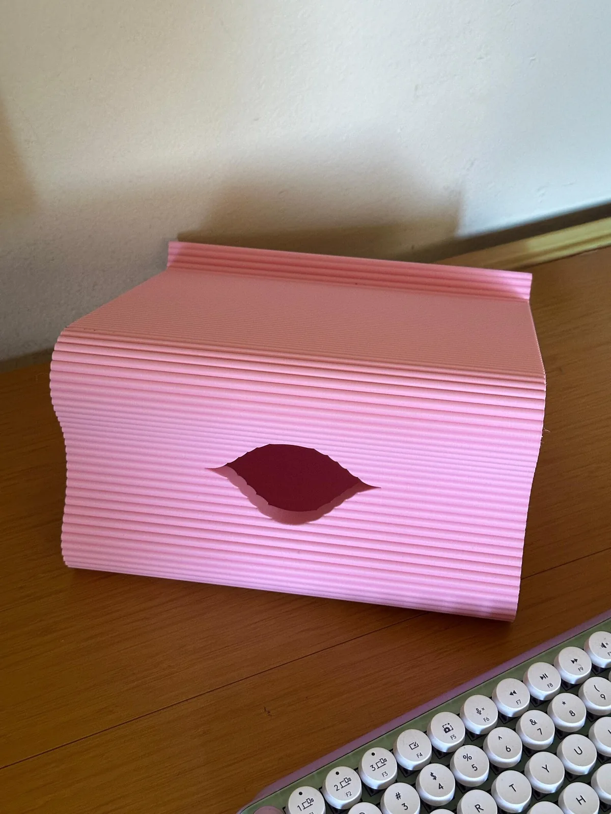The back of the pink stand, with the hole for cables